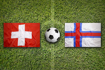 Image showing Switzerland vs. Faeroe Islands flags on soccer field