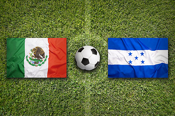 Image showing Mexico vs. Honduras flags on soccer field
