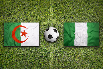 Image showing Algeria vs. Nigeria flags on soccer field