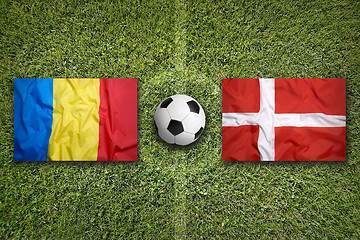 Image showing Romania vs. Denmark flags on soccer field