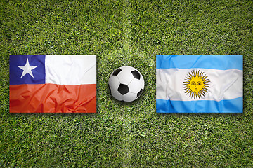 Image showing Chile vs. Argentina flags on soccer field