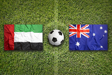 Image showing United Arab Emirates vs. Australia flags on soccer field