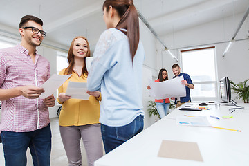 Image showing creative team on coffee break talking at office