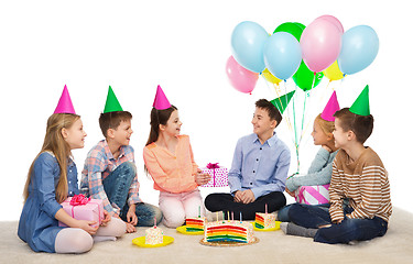 Image showing happy children giving presents at birthday party