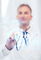 Image showing male doctor with stethoscope and cardiogram