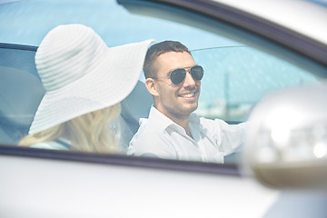 Image showing happy man and woman driving in cabriolet car