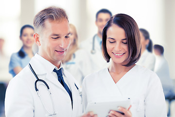 Image showing two doctors looking at tablet pc