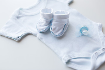 Image showing close up of baby boys clothes for newborn on table