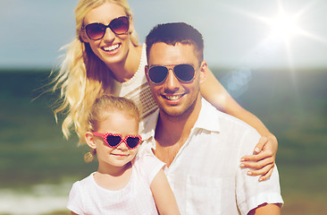 Image showing happy family in sunglasses on summer beach