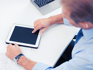 Image showing businessman with tablet pc in office