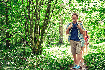 Image showing group of smiling friends with backpacks hiking