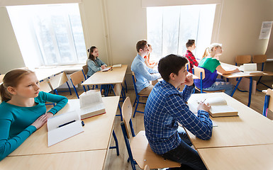 Image showing group of students with books at school lesson