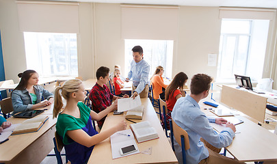 Image showing group of students and teacher with test results