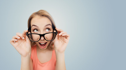 Image showing happy young woman or teenage girl in eyeglasses