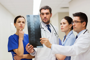 Image showing group of medics with spine x-ray scan at hospital