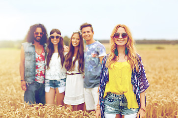 Image showing smiling young hippie friends on cereal field