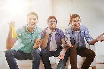 Image showing happy male friends with vuvuzela