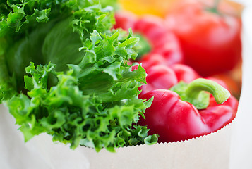 Image showing close up of paper bag with vegetables and greens
