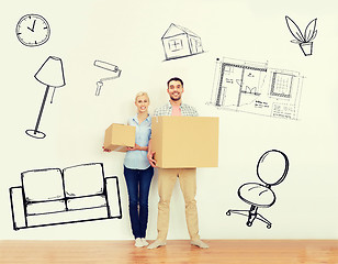 Image showing couple with cardboard boxes moving to new home