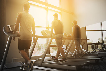 Image showing men exercising on treadmill in gym