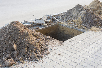 Image showing Dug a pit for planting trees on the pavement of paving slabs