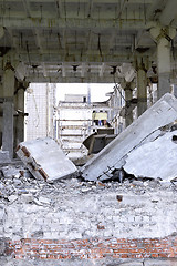 Image showing Pieces of Metal and Stone are Crumbling from Demolished Building Floors