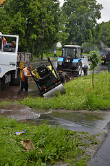 Image showing Car rides in heavy rain on a flooded road