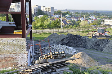 Image showing Construction materials and waste on the background of building under construction