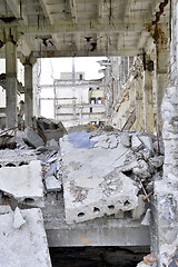 Image showing Pieces of Metal and Stone are Crumbling from Demolished Building Floors