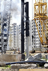 Image showing Mechanism scores piles at construction site