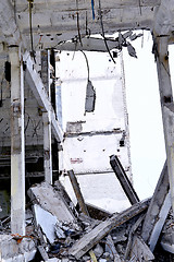 Image showing Pieces of Metal and Stone are Crumbling from Demolished Building