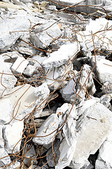 Image showing Pieces of Metal and Stone are Crumbling from Demolished Building