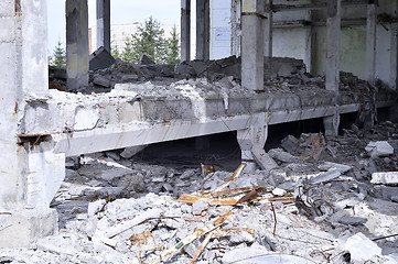 Image showing Pieces of Metal and Stone are Crumbling from Demolished Building
