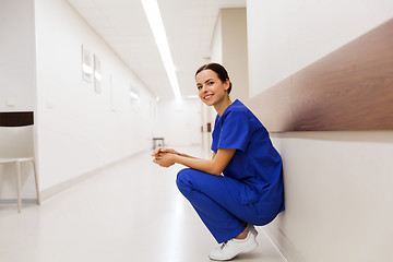 Image showing happy doctor or nurse at hospital corridor