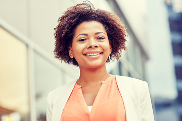 Image showing happy young african american businesswoman in city