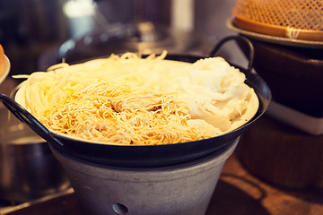 Image showing bowl of rice noodles garnish at asian restaurant