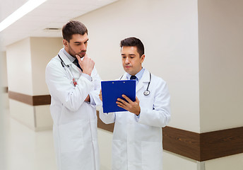 Image showing two male doctors with clipboard at hospital