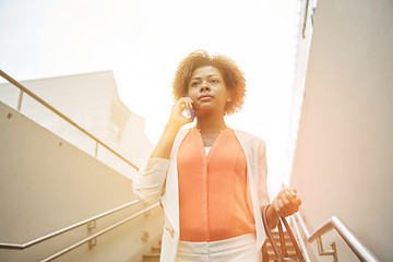 Image showing african businesswoman calling on smartphone