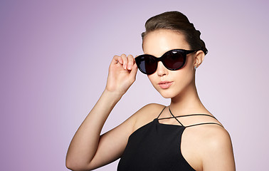 Image showing beautiful young woman in elegant black sunglasses