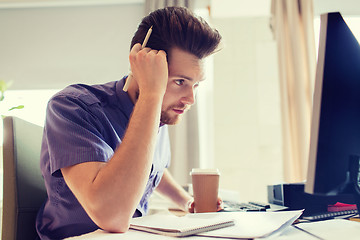 Image showing creative male office worker with coffee thinking