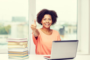 Image showing happy african american woman with laptop at home