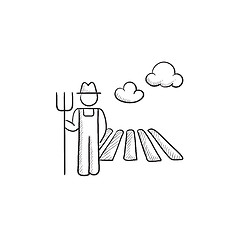 Image showing Farmer with pitchfork at field sketch icon.