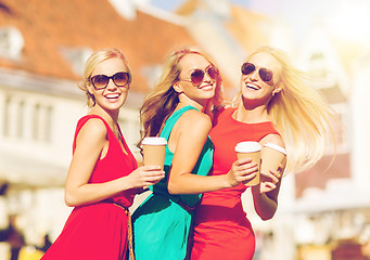 Image showing women with takeaway coffee cups in the city