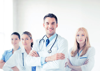 Image showing male doctor in front of medical group