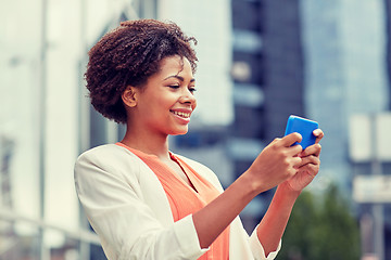 Image showing happy african businesswoman with smartphone