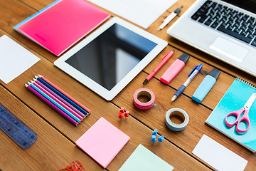 Image showing close up of school supplies and tablet pc