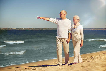 Image showing happy senior couple on summer beach