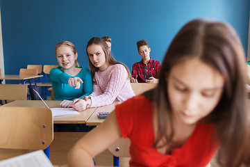 Image showing students gossiping behind classmate back at school