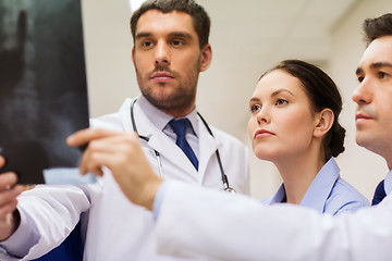 Image showing group of medics with spine x-ray scan at hospital