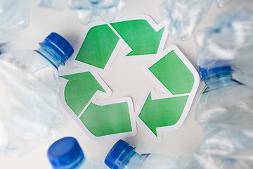 Image showing close up of plastic bottles and recycling symbol